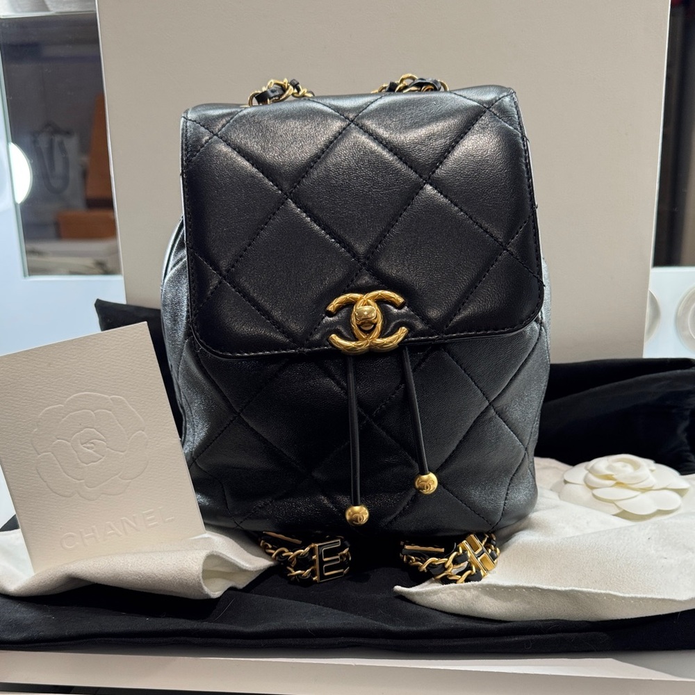 CHANEL Black Quilted Leather Drawstring Backpack with Gold CC Hardware
